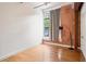 Bedroom with hardwood floors, exposed brick wall and natural light at 1261 Caroline Se St # 108, Atlanta, GA 30307