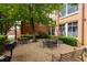 Outdoor seating area with tables and chairs, perfect for relaxing and enjoying the building's courtyard at 1261 Caroline Se St # 108, Atlanta, GA 30307