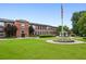 Beautiful brick exterior of the Shoe Factory Lofts with well-maintained lawn and gazebo at 1261 Caroline Se St # 108, Atlanta, GA 30307