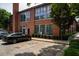 Exterior view of brick building with large windows and parking at 1261 Caroline Se St # 108, Atlanta, GA 30307
