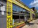 Eye-catching exterior of Branch Vegan Bakery, vibrant yellow and black paint scheme at 1261 Caroline Se St # 108, Atlanta, GA 30307