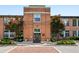 Lovely brick facade with well-kept landscaping and a welcoming entrance to the building at 1261 Caroline Se St # 108, Atlanta, GA 30307