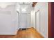 Hallway featuring hardwood floors, white trim, and multiple doors at 1261 Caroline Se St # 108, Atlanta, GA 30307