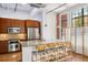 Modern kitchen with granite countertops, stainless appliances, and hardwood flooring at 1261 Caroline Se St # 108, Atlanta, GA 30307
