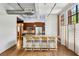 Open kitchen featuring an island with barstool seating, stainless steel appliances, and natural light at 1261 Caroline Se St # 108, Atlanta, GA 30307