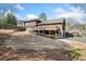 Backyard with lush landscaping, hardscape, and well-maintained lawn, creating a serene outdoor space at 1905 Castleway Ne Ln, Atlanta, GA 30345