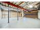 Spacious unfinished basement with high ceilings and a roll-up garage door, great for storage and projects at 1905 Castleway Ne Ln, Atlanta, GA 30345