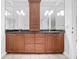 Bathroom featuring double vanity with granite countertop and a large mirror at 1905 Castleway Ne Ln, Atlanta, GA 30345