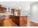Spacious kitchen featuring a large island, stainless steel appliances, and hardwood floors at 1905 Castleway Ne Ln, Atlanta, GA 30345