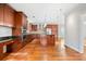 Spacious kitchen with cherry cabinets, granite countertops, and stainless steel appliances at 1905 Castleway Ne Ln, Atlanta, GA 30345
