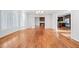 Inviting living room with hardwood floors leading into kitchen area at 1905 Castleway Ne Ln, Atlanta, GA 30345