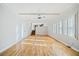 Spacious living room featuring hardwood floors, white trim, and neutral paint at 1905 Castleway Ne Ln, Atlanta, GA 30345