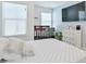 Charming bedroom with a crib, TV, dresser, and a soothing color palette, perfect for a Bedroom at 2711 Kemp Ct, Conyers, GA 30094