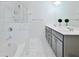 Well-lit main bathroom with double sinks, a bathtub, a separate shower, and contemporary fixtures at 2711 Kemp Ct, Conyers, GA 30094