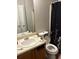 Bathroom with a vanity, sink, and toilet, plus a shower with a black and white curtain at 3464 Kingswood Trl, Decatur, GA 30034