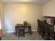 Cozy dining area featuring carpet floors, complemented by a table with green legs and a matching chair at 3464 Kingswood Trl, Decatur, GA 30034