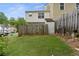 Fenced backyard with some grass, and a storage shed, providing outdoor space at 3468 Washington Way, Doraville, GA 30340
