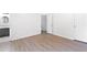 Spacious bedroom with wood floors, a doorway to the hallway, and a doorway to the bathroom at 3468 Washington Way, Doraville, GA 30340