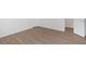 Bedroom showcasing wood flooring and an open closet space at 3468 Washington Way, Doraville, GA 30340