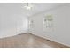 Spacious bedroom has a closet, two windows, and light hardwood flooring at 3468 Washington Way, Doraville, GA 30340