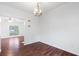 Bright dining room with hardwood floors and chandelier fixture at 3468 Washington Way, Doraville, GA 30340