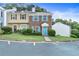 Charming townhome with brick facade, blue shutters, and a well-maintained front yard at 3468 Washington Way, Doraville, GA 30340