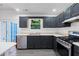 Updated kitchen featuring stainless steel appliances and ample counter space at 3468 Washington Way, Doraville, GA 30340