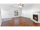 Inviting living room featuring a fireplace, hardwood floors, and ample natural light at 3468 Washington Way, Doraville, GA 30340