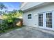Concrete patio with fenced yard, and French doors to the main house at 3468 Washington Way, Doraville, GA 30340