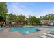 Large community swimming pool with lounge chairs and landscaping, perfect for relaxing at 3468 Washington Way, Doraville, GA 30340