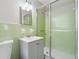 Bathroom with vintage green tile, a gray vanity and a shower with sliding glass doors at 4616 Greensprings Rd, Atlanta, GA 30337