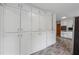 Kitchen with ample pantry storage and modern vinyl flooring at 4616 Greensprings Rd, Atlanta, GA 30337