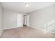Bright bedroom with neutral paint, carpet and a closet at 1151 Rankin St # 20A, Stone Mountain, GA 30083