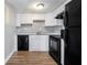 Functional kitchen featuring updated appliances, white cabinets, and granite countertops at 1151 Rankin St # 20A, Stone Mountain, GA 30083