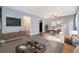 Bright living room features hardwood floors, modern furnishings, and a dining area at 1151 Rankin St # 20A, Stone Mountain, GA 30083