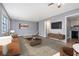 Open-concept living room with a comfortable sofa, media center and a view of the kitchen at 1151 Rankin St # 20A, Stone Mountain, GA 30083