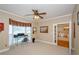 Bedroom featuring neutral walls, bay window, and doorway to adjacent spaces at 1460 Badingham Dr, Cumming, GA 30041