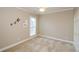 Neutral bedroom with plush carpet, ceiling fan, and decorative accents for a cozy, inviting space at 1460 Badingham Dr, Cumming, GA 30041