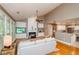 Bright living room with fireplace, built-ins, hardwood floors, and lots of natural light at 1460 Badingham Dr, Cumming, GA 30041