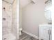 Bathroom with tile floors, large shower, white vanity at 1887 King Charles Sw Rd, Atlanta, GA 30331