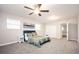 Bright bedroom with neutral walls, plush carpeting, and a comfortable bed with a quilted comforter at 1887 King Charles Sw Rd, Atlanta, GA 30331