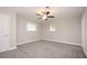 Bright bedroom with neutral walls, plush carpet, and natural light from two windows at 1887 King Charles Sw Rd, Atlanta, GA 30331