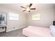 Bright bedroom with neutral walls, plush carpet, and natural light from two windows at 1887 King Charles Sw Rd, Atlanta, GA 30331