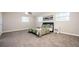 Bright bedroom with neutral walls, plush carpeting, and a comfortable bed with a quilted comforter at 1887 King Charles Sw Rd, Atlanta, GA 30331