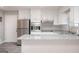 Well-lit kitchen featuring stainless steel appliances and modern white cabinets and granite countertops at 1887 King Charles Sw Rd, Atlanta, GA 30331