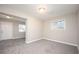 Open living room area with great carpet space for furnishings and lots of light from the windows at 1887 King Charles Sw Rd, Atlanta, GA 30331