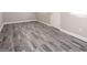 A bright living room features neutral walls, gray-toned flooring and a doorway that allows for natural light at 1887 King Charles Sw Rd, Atlanta, GA 30331