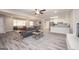 Open-concept living area and kitchen space with wood-look flooring, providing a seamless flow throughout at 1887 King Charles Sw Rd, Atlanta, GA 30331
