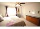This spacious bedroom features a guitar on the wall and a plush comfortable bed at 2706 Park Land Ln, Snellville, GA 30078