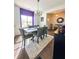An open dining area featuring modern décor, large windows and stylish furnishing at 2706 Park Land Ln, Snellville, GA 30078